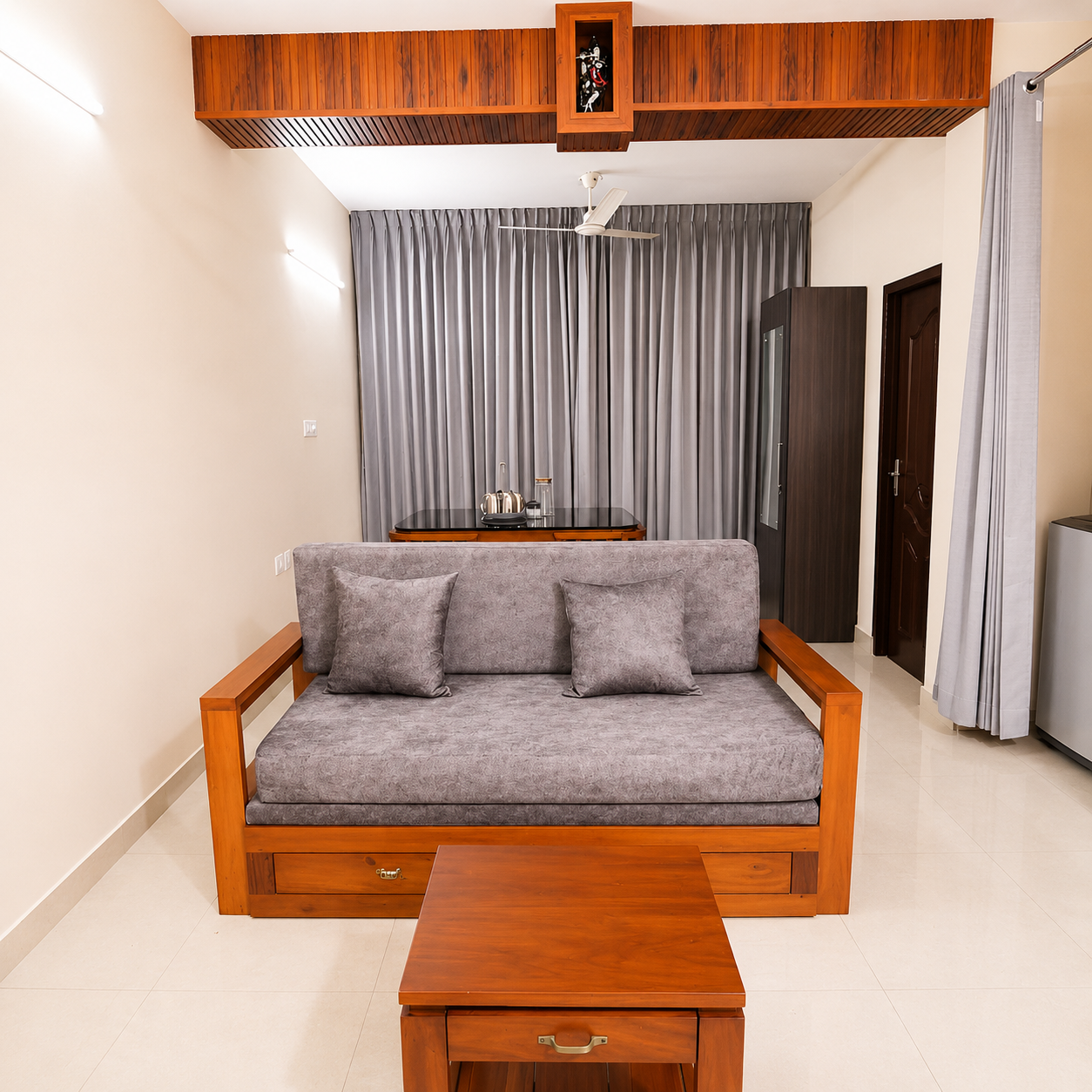 Comfortable seating sofa area at Hima Havens Guruvayur Homestay